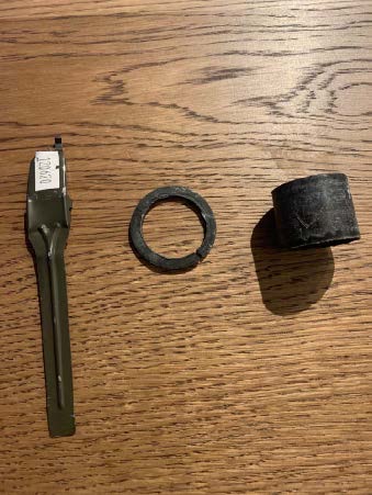 Thick plastic ring, metal handle with numbered label – Fuse box and pull handle from blast grenade